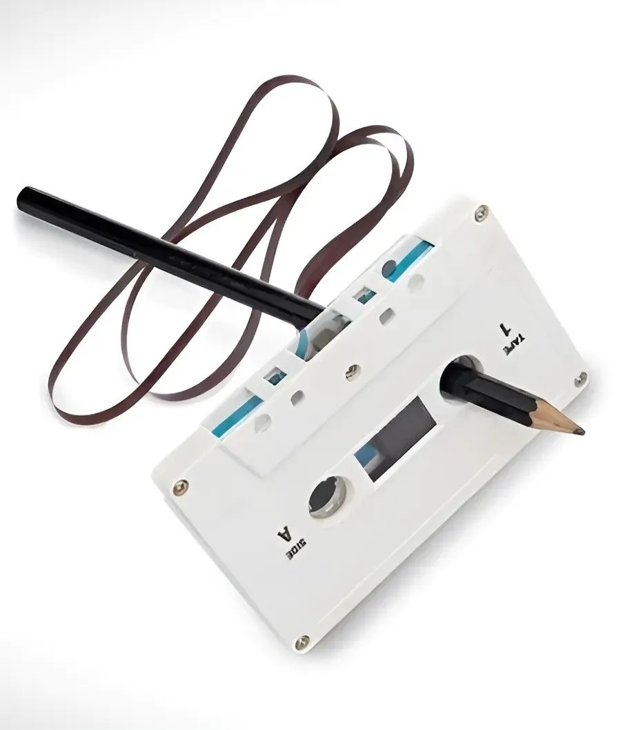 Using a pencil to wind mix tapes back.jpg?format=webp