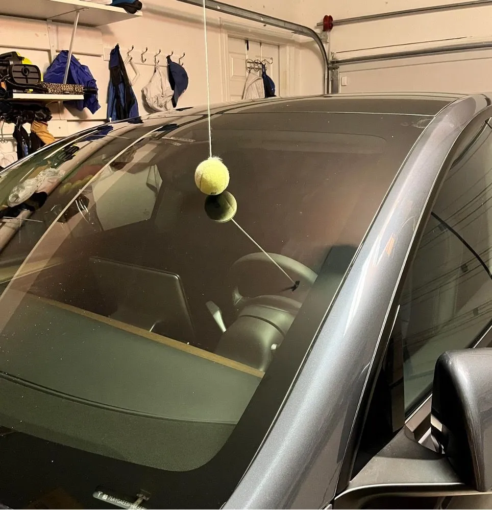 12. A Suspended Tennis Ball Will Help Prevent a Collision with a Garage Wall.jpg?format=webp