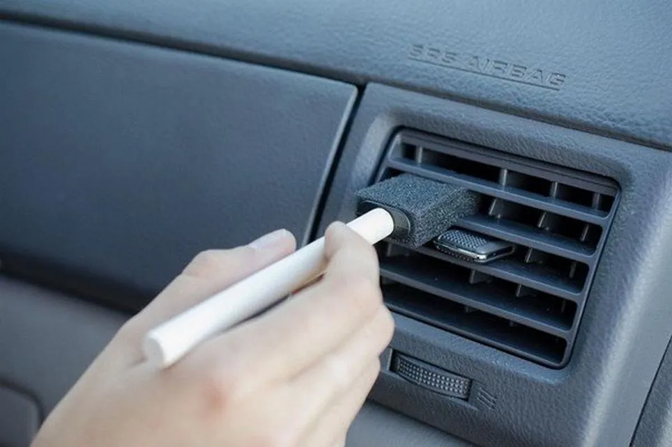 28.  Cleaning the Air Vents with a Foam Brush.jpg?format=webp